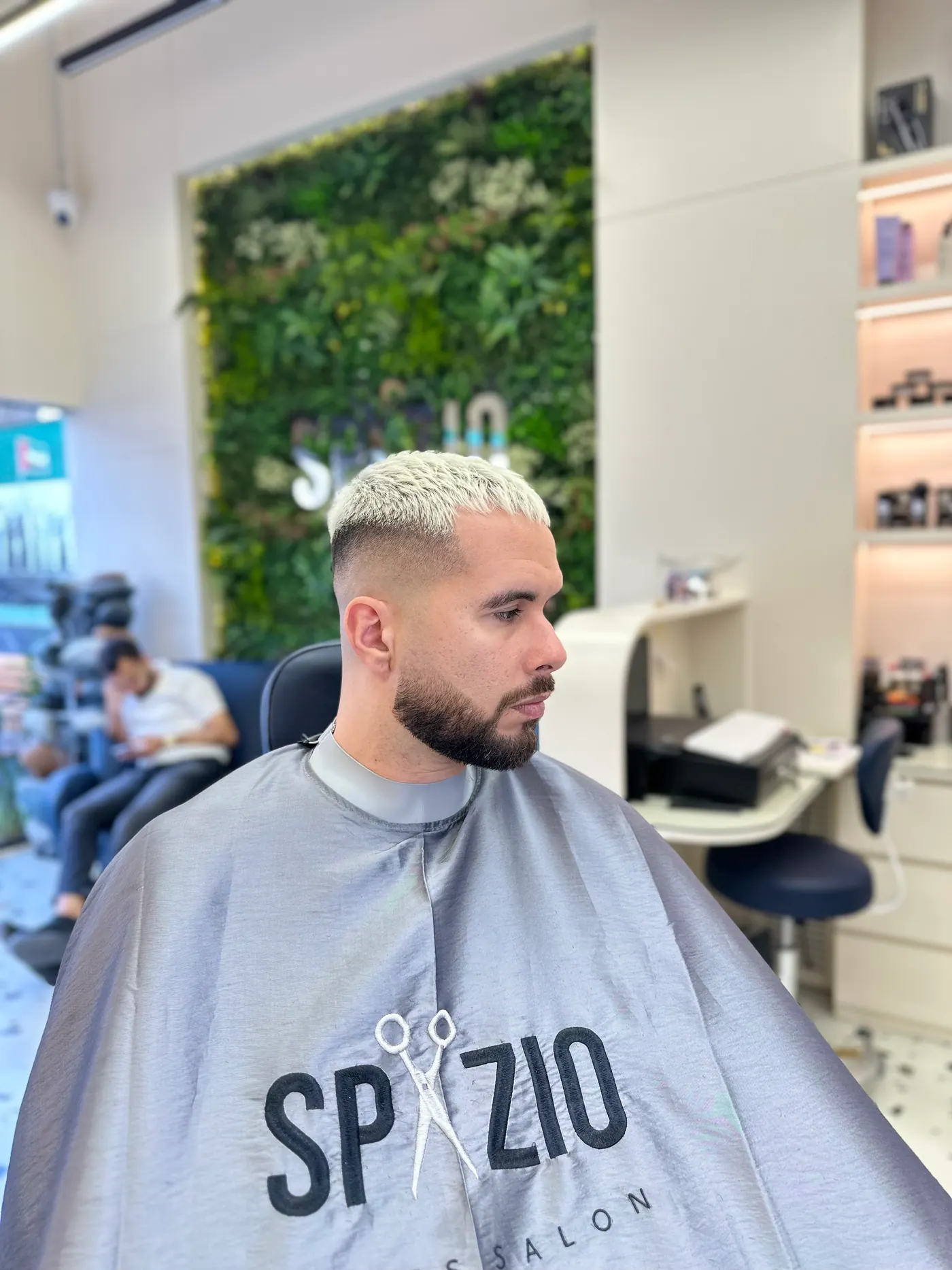 Client with a light fade and shaped beard at Spazio barber shop in JVC