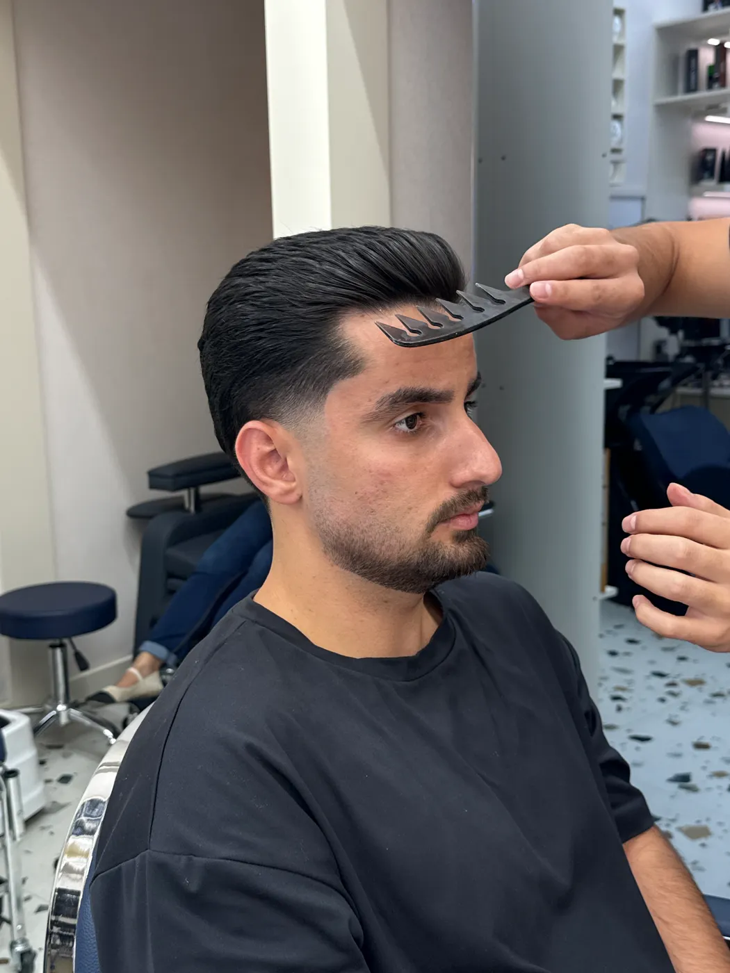 Finished pompadour with a low fade, combed through at Spazio Gents Salon JVC