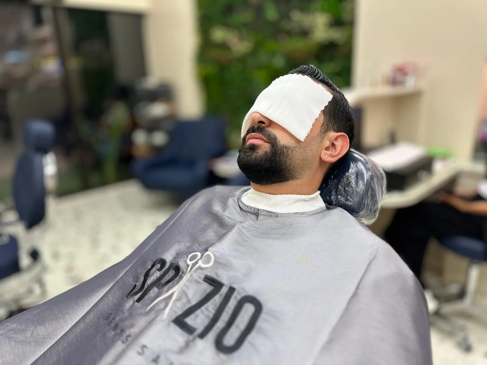 Hot towel facial treatment for men at Spazio Gents Salon in JVC, Dubai