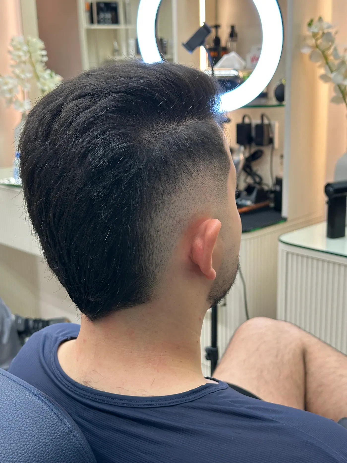 Quiff with a tapered fade finished at a styling station in Spazio JVC