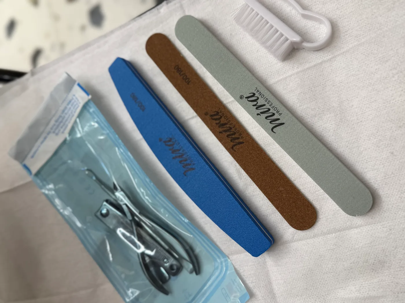 Sterilised manicure tools in a sealed pouch opened for each client at Spazio Gents Salon JVC
