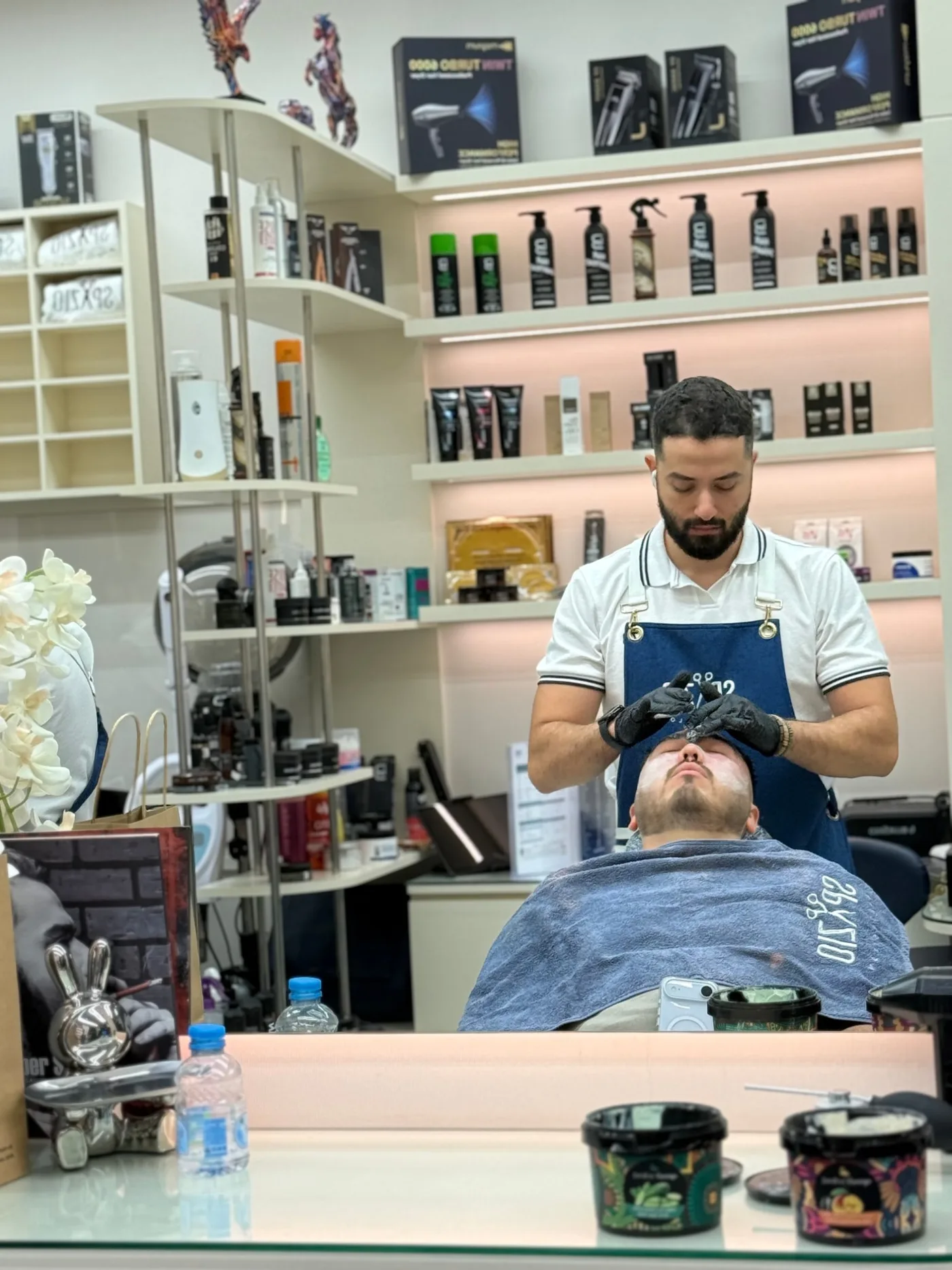 Deep pore cleansing facial for men being applied at Spazio Gents Salon in Jumeirah Village Circle, Dubai